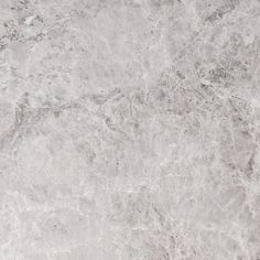 a white marble textured background or wallpaper that looks like it could be used as a floor covering