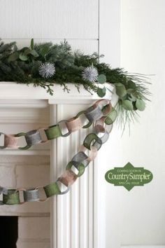 the garland is hanging on the fireplace mantel