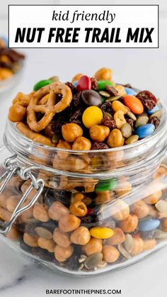 a glass jar filled with nuts and pretzels