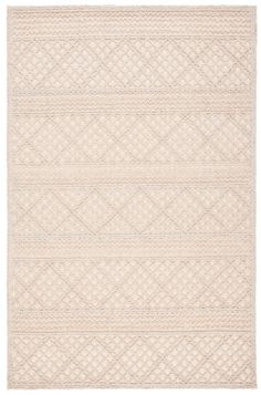 a white rug with an intricate design on the top and bottom, it is made out of