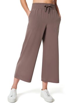 Take on the weekend in sporty-chic wide-leg pants featuring a smoothing high waistband and four-way-stretch fabric that wicks moisture and resists static. 25" inseam; 23" leg opening; 12 1/2" front rise; 17 1/2" back rise (size Medium) Elastic/drawstring waist Front slant pockets Moisture-wicking fabric engineered for dryness and comfort 88% polyester, 12% elastane Dry clean or machine wash, tumble dry Imported Stretch Wide Leg Ankle-length Pants For Loungewear, Stretch Wide Leg Ankle-length Loungewear Pants, Wide Leg Activewear With Pockets And 4-way Stretch, Viscose Wide Leg Ankle-length Pants For Loungewear, Ankle-length Viscose Wide Leg Loungewear Pants, Men Home Decor, Cropped Wide Leg Pants, Casual Fridays, Out Of Office