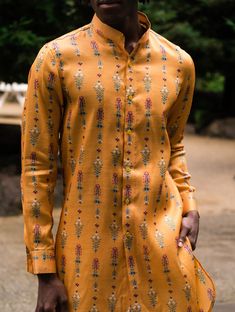 Be the most stylish and comfortable person in the room wearing this modern take on a kurta. Saffron silk blend shorter kurta with Mughal floral print, buttons all the way down. Ivory Pants, Wedding Kurta, Wedding Kurta For Men, Cream Pants, In The Room, New Launch, Way Down, The Room, All The Way