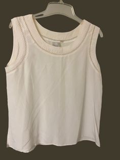 Off white tank top Size L 20 inches across Length- 24 inches No noticeable marks White Scoop Neck Summer Vest, White Scoop Neck Vest For Spring, White Scoop Neck Vest For Summer, White Sleeveless Vest Top, White Knit Tank Top For Spring, White Cami Top, Womens Tank Tops, Tank Top White, White Tank Top