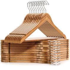 wooden clothes hangers stacked on top of each other