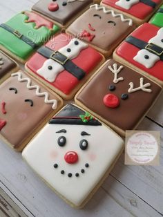 decorated christmas cookies arranged in the shape of snowmen