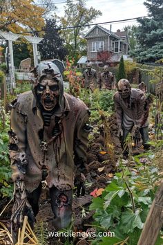 the zombies are walking through the garden with their heads covered in mud and plastic covering them