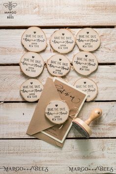 wooden save the date magnets and rubber stamp on wood planks with wedding favors