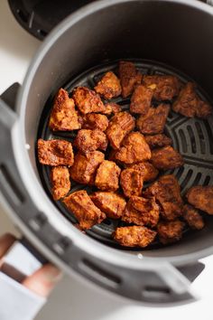 the food is being cooked in the slow cooker