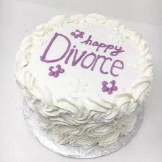 a white cake with purple frosting and the words happy divore written on it