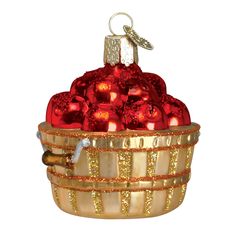 a basket filled with red and gold ornaments