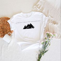 Faith inspirational tee! Greater than the mountains crew neck. Comes in sizes S through 3XL. Made to order in a t-shirt style or sweatshirt crew. Size chart and color chart in pictures! Our shirts are made with durable vinyl, delivering a smooth and soft finish. The shirts are handmade to order. NO cancellations after 12 hours. Please check that your address is correct before submitting your order. Please allow 7 business days to ship. If you need a rush order, please reach out to us!  Thank you for your order. Cat Dad Shirt, Faith Tees, Cat Lover Shirt, Inspirational Tees, Nature Shirts, Pet Shirts, Teacher Tees, Comfy Sweatshirt, Greater Than