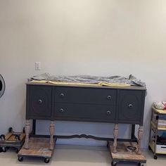 an old dresser and other furniture in a room