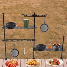 an outdoor table with pots and pans on it