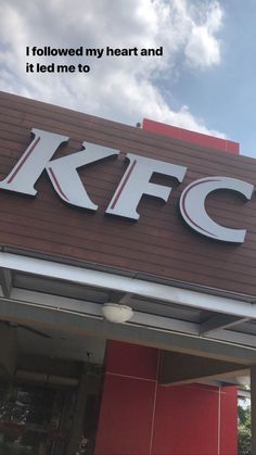 a kfc sign on the side of a building that says i followed my heart and it led me to