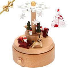 a wooden music box with christmas decorations on it