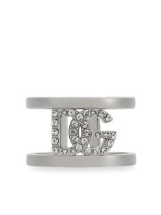 rhinestone cuff bracelet from DOLCE & GABBANA featuring silver-tone, polished effect, rhinestone embellishment, logo lettering and slip-on style. Modern Sterling Silver Jewelry With Logo, Luxury Sterling Silver Jewelry With Logo, Silver Metal Jewelry With Metal Logo, Silver Metal Jewelry With Logo, Luxury Silver Jewelry With Logo, Luxury Silver Jewelry With Metal Logo, Designer Silver Jewelry With Logo, Modern Metal Jewelry With Logo, Luxury Silver Rings With Rhinestones