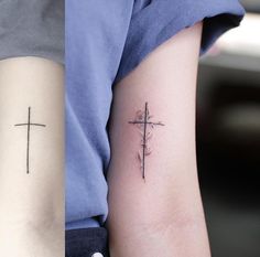 a small cross tattoo on the arm