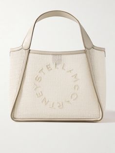 Stella McCartney's tote is hand-crocheted from cotton and reinforced with vegan leather trims and structured mesh lining. It's appliquéd with the label's circular logo and comes with an optional shoulder strap and interior pouch to keep small items close at hand. There's plenty of space for your phone, sunglasses, wallet and planner. Circular Logo, Stella Mccartney Bag, Cotton Totes, Leather Top, Small Items, Womens Tote Bags, Body Bag, Fashion Bracelets, Fashion Watches