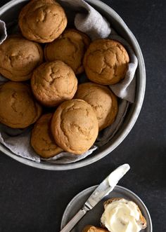 a bowl filled with cookies and cream on top of a table next to a fork