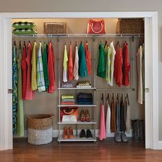 an organized closet with clothes and shoes