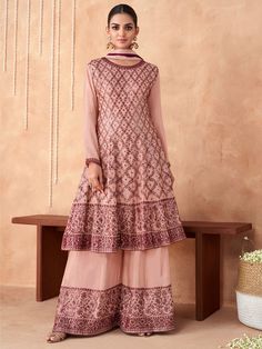 Buy inddus gratifying pink embroidered partywear palazzo suit online online at best price on Inddus. This gratifying partywear palazzo suit set comes with a georgette kurta with georgette palazzo and chinon dupatta.Shop this designer palazzo style suit online and get the benefit of express home delivery across the globe Beige Bridesmaids, Long Anarkali Gown, Georgette Palazzo, Plazzo Suits, Pink Anarkali, Latest Salwar Kameez, Palazzo Suit, Plus Size Suits, Yellow Bridesmaids