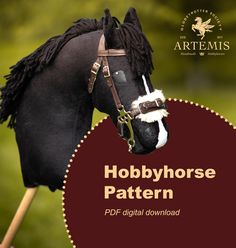 a black horse wearing a bridle with the words hobby horse pattern on it