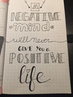 an open notebook with writing on it and the words give you positive life written in cursive ink