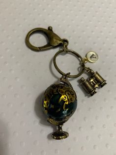 a keychain that has a glass ball on it