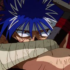 an anime character with blue hair holding a knife in his hand and looking at the camera