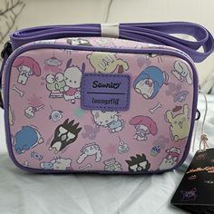 New With Tags Sanrio Loungefly Bag Bag Is 7" X 2.5" X 6.5 P.S. Not All Prints On These Bags Are The Same, I Like How The Front Of This Bag Shows All The Characters. Purple Satchel Shoulder Bag, Portable Purple Satchel Shoulder Bag, Purple Portable Bags For Daily Use, Portable Purple Shoulder Bag For Travel, Cute Purple Pouch Bag, Cute Purple Crossbody Shoulder Bag, Purple Pouch Shoulder Bag For School, Portable Purple Shoulder Bag For Daily Use, Daily Use Purple Shoulder Bag