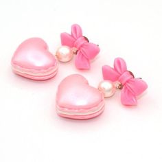 These adorable earrings are perfect for Valentine's Day or anytime of the year! Pastel pearl finish heart shaped macaron charms filled with whipped cream hung below pink bow posts with glass pearls. Posts are hypoallergenic surgical steel. Choose pink, purple or mint green. Charms are about 1" wide. Total earring length: about 2". Matching necklaces and rings in my shop>> https://etsy.com/shop/fatallyfeminine**Made to order - please allow 2 weeks for your item to be made before shipment**E