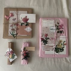 the package is wrapped in pink paper and has flowers on it, along with other items