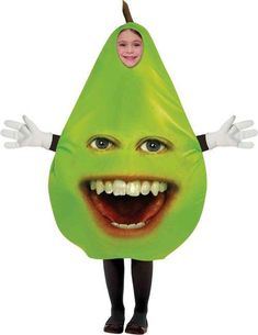 a person in a green pear costume with hands on their hips and eyes open, smiling at the camera