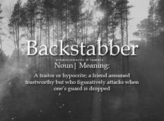 a black and white photo with the words backstabberr in front of trees