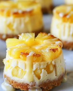 mini pineapple cheesecakes with icing on a plate