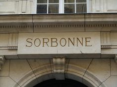 an old building with a sign that says sorbonine on the front door