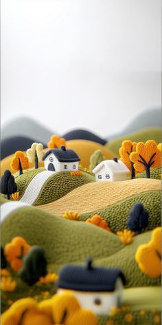 small houses are on the hills with trees and flowers in them, as if they were made out of clay