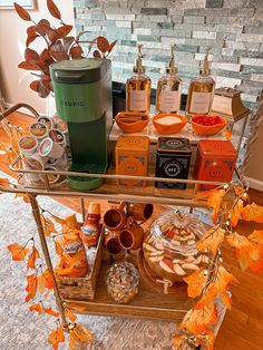 an assortment of items displayed on a shelf in front of a brick wall and fireplace