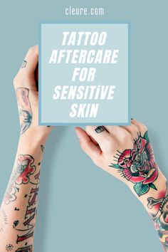 two hands holding up a sign that says tattoo aftercare for sensitive skin