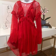 A Beautiful Fire Red Dress By Free People. Material Is Silk With Lace Details And Open Back. Length Is Above The Knee. Red Long Sleeve Mini Dress In Flirty Style, Red Lace Dress Short, Red Long Sleeve Mini Dress Flirty Style, Red Lace Dress Short Long Sleeve, Red Long Sleeve Mini Dress With Ruffles, Red Bohemian Knee-length Dress, Feminine Red Long Sleeve Mini Dress, Red Short-sleeved Lace Dress, Red Long Sleeve Mini Dress, Flirty Style