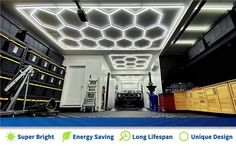 the inside of a garage with various items on display and in front of it is a light fixture that looks like hexagon