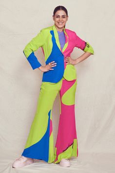 Lime, hot pink and blue natural crepe printed colourblock blazer. Paired with wide leg pant.
Components:2
Pattern:Printed
Type of Work:Abstract shape print
Neckline:Shawl collar
Sleeve Length:Full sleeves
Fabric:Natural crepe
Color:Green,Pink,Blue
Other Details:
Single button blazer
Occasion:Party - Aza Fashions Fitted Multicolor Color Block Pants, Trendy Multicolor Workwear Sets, Trendy Multicolor Sets For Workwear, Fitted Multicolor Pantsuit For Workwear, Chic Multicolor Wide Leg Sets, Chic Multicolor Workwear Sets, Trendy Multicolor Workwear Pants, Trendy Multicolor Pants For Workwear, Trendy Multicolor Pants For Work