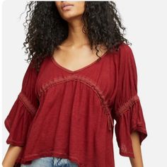 Free People Sand Storm Top In Sanquine Size Small Brand New With Tags Brand New With Tags Free People Red Top Sand Storm Top Color: Sanquine V-Neckline 3/4 Sleeve Pullover Style Drawstrings Detail ( Missing 1 Drawstring On Back ) Handkerchief Hem Sz Small Bohemian Burgundy Tops For Spring, Burgundy V-neck Top For Summer, Burgundy V-neck Blouse For Summer, Burgundy V-neck Summer Top, Summer Burgundy V-neck Top, Red Casual Top For Brunch, Chic Burgundy Summer Tops, Casual Red Top For Brunch, Chic Burgundy Tops For Summer