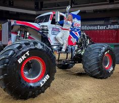 the monster truck is painted red, white and blue