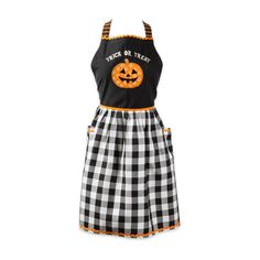 a black and white checkered apron dress with pumpkins on the front, an orange patch