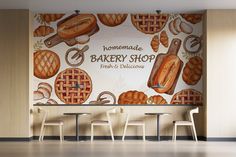 a bakery shop wall mural in an empty room with four chairs and two stools