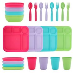 various colored plastic dishes and spoons on a white background