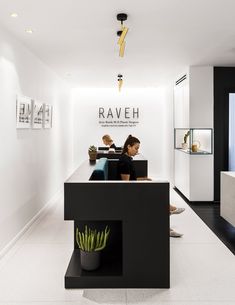 two women are sitting at the reception desk