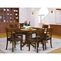 a dinning room table with chairs around it