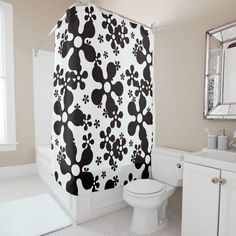 a bathroom with a mickey mouse shower curtain